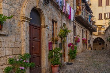 Fototapeta na wymiar Narrow street in the old town of Ascoli Piceno in Italy
