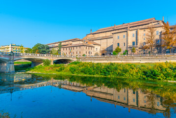 Palazzo della Pilotta behind a river in Parma, Italy