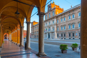 Palazzo Ducale viewed through an arcade in Italian town Modena