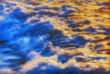 Incoming whitewater wave crashing on the shore