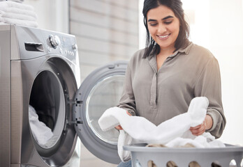 They look as good as new. Shot of a young woman doing laundry at home.