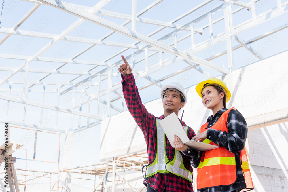 Poster asian engineer foreman worker man and woman working at building construction site use laptop and tal