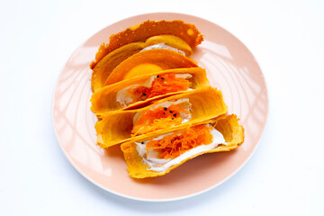 Thai crispy pancakes on white background.