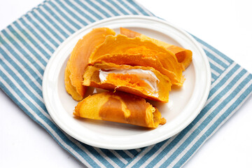 Thai crispy pancakes on white background.