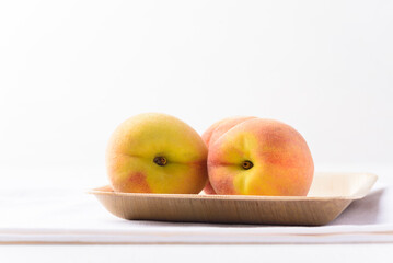 Fresh peach fruit on white background
