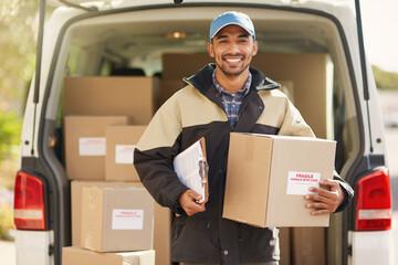 I always get deliveries out on time. Portrait of a smiling delivery man standing in front of his van holding a package.