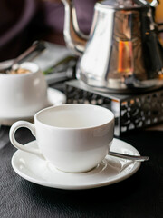 drink tea from a metal teapot