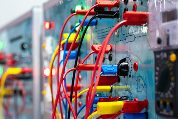 Electrical equipment. Electrical panel with many wires. Multi-colored wires are connected to...