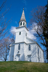Fototapeta na wymiar Warwick, NY - USA - April 2, 2022: Vertical view of the historic Old School Baptist Meeting house ilocated in the village of Warwick.
