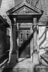 door to a mausoleum in Pere Lachaise cemetery Paris france 