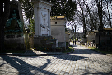 people walking in the Pere Lachaise cemetery Paris france 