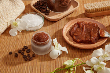 A closeup view of coffee bean and powder decorated with wooden tray candles and flower in wooden background for exfoliating advertising , mixture of coffee and salt 