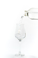 glass bottle with water and glass, white background