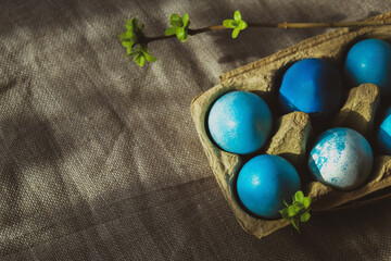 Blue coloured Easter eggs. Easter food background.