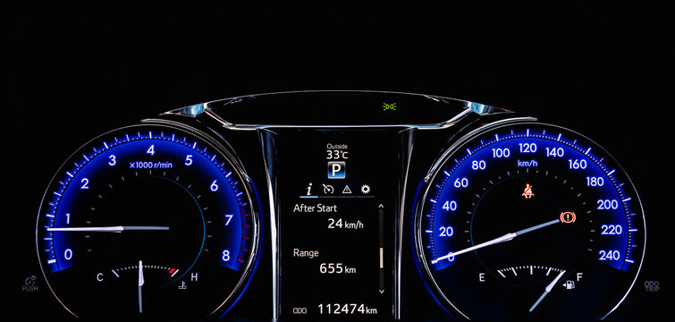 Close up of car dashboard modern Instrument automobile panel with Odometer, speedometer, tachometer, fuel level.