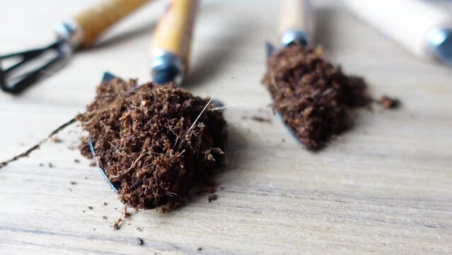  coco peat and gardening tools a table with copy space 