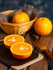 fresh oranges on the table and in a basket