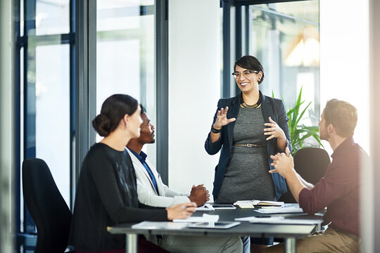 Lifes too short to think small. Shot of a businesswoman delivering a presentation to her coworkers.
