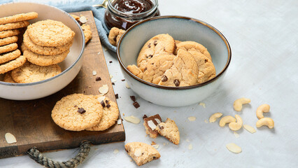 Delicious oat cookies on light background.