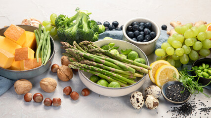 Raw and fresh vegetables and fruit on light background.