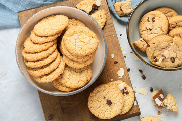 Delicious oat cookies on light background.