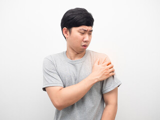 Man grey shirt gesture pain his shoulder white background