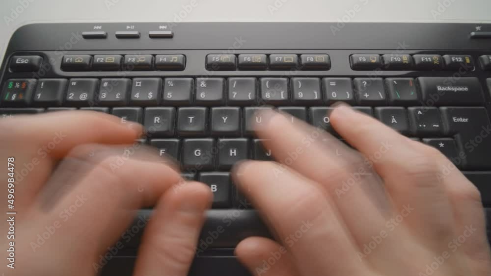 Poster man typing on a keyboard. close up. timelapse
