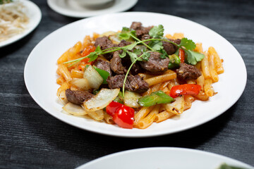 A view of a plate of shaking beef.
