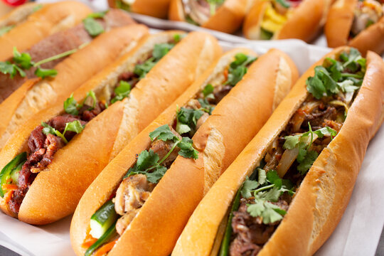 A view of a several banh mi sandwiches.