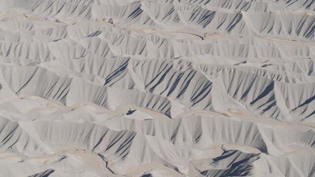 High angle drone above bentonite clay fins in Utah desert landscape