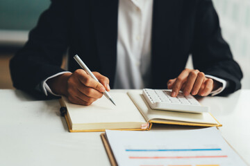 Business man investment consultant analyzing company annual financial report balance sheet statement working with documents graphs. Concept picture of business, market, office, tax.