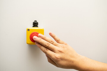 Stop Red Button and the Hand of Worker About to Press it. emergency stop button. Big Red emergency...