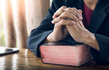 Christian man praying with the Bible, Pray and worship concept.