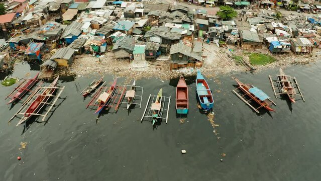 Poor district and slums in Manila with shacks and buildings. Manila, Philippines.