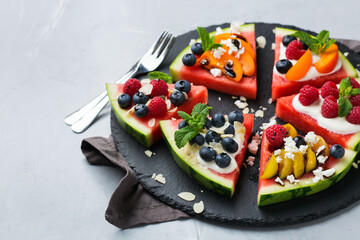 Watermelon pizza with berries, fruit, yogurt, feta cheese