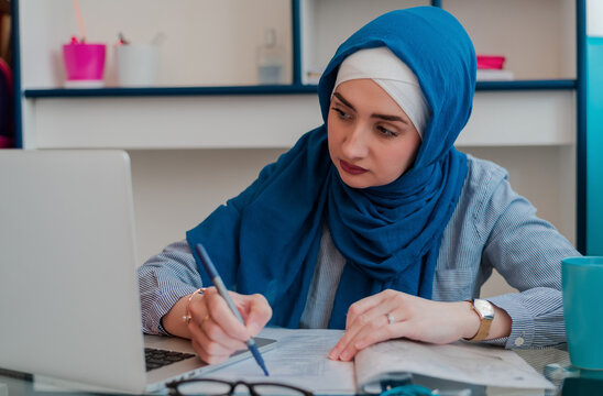 Muslim Woman Working In Home Office. 