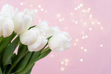 Obraz premium Beautiful delicate bouquet of tulip flowers on pink background header. Panoramic web banner with copy space for design, bokeh. Spring holidays concept, March 8, Easter, Valentines Day 