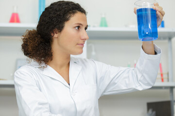 woman chemist making a mixture