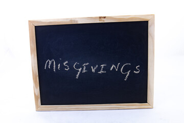 The term misgivings written on a chalkboard