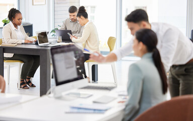Productivity is at the top of everyones list. Shot of businesspeople working in an office.