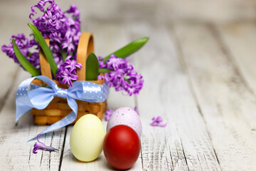 Easter composition with egg and Hyacinth spring flowers on wooden background