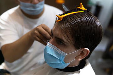 Life in Asia under pressure during novel Coronavirus, Omicron.  Caucasian male and Chinese...