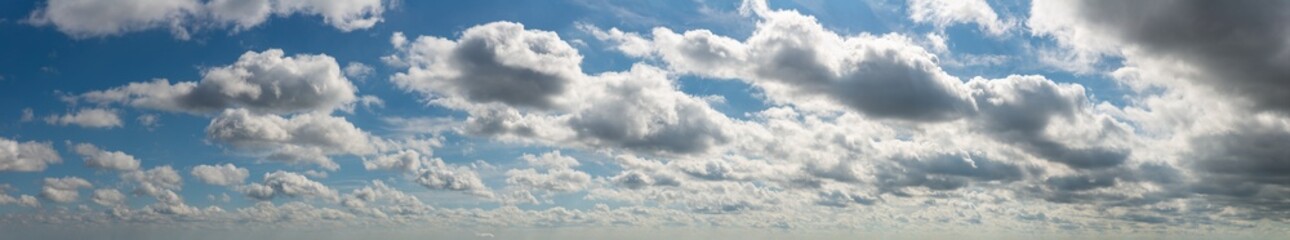 Fototapeta na wymiar Fantastic soft thunderclouds, sky panorama