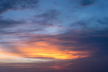 Naklejka na ściany i meble Dramatic twilight landscape of sunset or sunrise sky with colorful cloud.