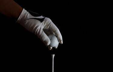 golfer showing golf ball on hand holding with green grass golf course sunlight rays background...