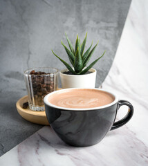 a cup of Hot Cocoa  in grey background
