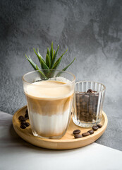 dirty coffee cup  on wood plate in grey background 