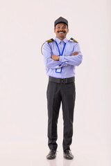 Portrait of security guard with arms folded 