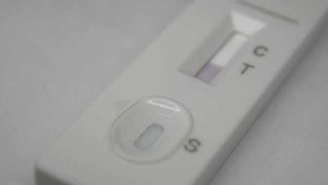 Close-up of the covid-19 antigen pcr express test cassette that has tested negative for COVID-19.