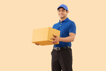 Portrait of a courier delivery boy with cardboard box in hand
